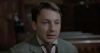 Movie still from “Three Colors: White” (1994), directed by Krzysztof Kieslowski – Close Up shot, Low angle