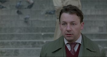 Movie still from “Three Colors: White” (1994), directed by Krzysztof Kieslowski – Close Up shot, Low angle