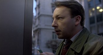 Movie still from “Three Colors: White” (1994), directed by Krzysztof Kieslowski – Close Up shot, Over the shoulder angle