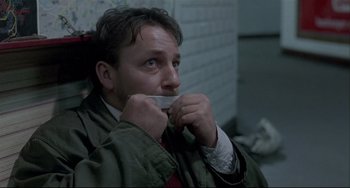 Movie still from “Three Colors: White” (1994), directed by Krzysztof Kieslowski – Close Up shot, Low angle