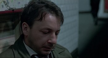 Movie still from “Three Colors: White” (1994), directed by Krzysztof Kieslowski – Close Up shot, Low angle