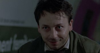 Movie still from “Three Colors: White” (1994), directed by Krzysztof Kieslowski – Close Up shot, Low angle