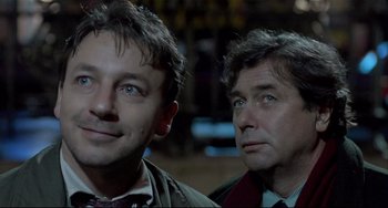 Movie still from “Three Colors: White” (1994), directed by Krzysztof Kieslowski – Close Up shot, Low angle