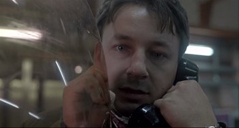 Movie still from “Three Colors: White” (1994), directed by Krzysztof Kieslowski – Close Up shot, Low angle