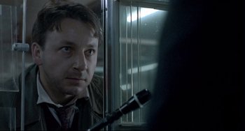 Movie still from “Three Colors: White” (1994), directed by Krzysztof Kieslowski – Close Up shot, Over the shoulder angle