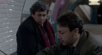 Movie still from “Three Colors: White” (1994), directed by Krzysztof Kieslowski – Medium shot, Over the shoulder angle