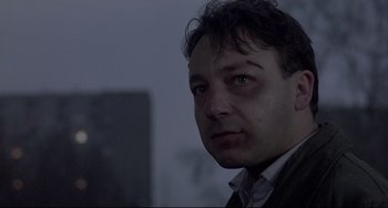 Movie still from “Three Colors: White” (1994), directed by Krzysztof Kieslowski – Close Up shot, Low angle