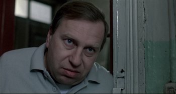 Movie still from “Three Colors: White” (1994), directed by Krzysztof Kieslowski – Close Up shot, Low angle