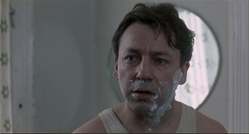 Movie still from “Three Colors: White” (1994), directed by Krzysztof Kieslowski – Close Up shot, Low angle