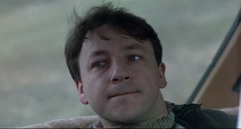 Movie still from “Three Colors: White” (1994), directed by Krzysztof Kieslowski – Close Up shot, Low angle