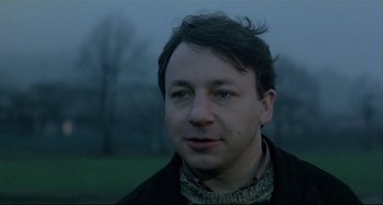 Movie still from “Three Colors: White” (1994), directed by Krzysztof Kieslowski – Close Up shot, Low angle