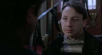 Movie still from “Three Colors: White” (1994), directed by Krzysztof Kieslowski – Close Up shot, Over the shoulder angle