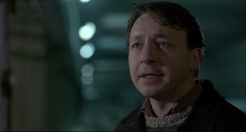 Movie still from “Three Colors: White” (1994), directed by Krzysztof Kieslowski – Close Up shot, Low angle