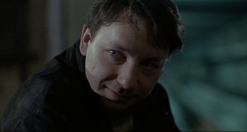 Movie still from “Three Colors: White” (1994), directed by Krzysztof Kieslowski – Close Up shot, Low angle