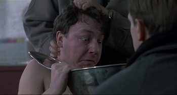 Movie still from “Three Colors: White” (1994), directed by Krzysztof Kieslowski – Close Up shot, Over the shoulder angle