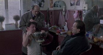 Movie still from “Three Colors: White” (1994), directed by Krzysztof Kieslowski – Medium shot, Over the shoulder angle