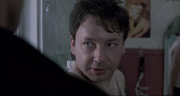 Movie still from “Three Colors: White” (1994), directed by Krzysztof Kieslowski – Close Up shot, Over the shoulder angle