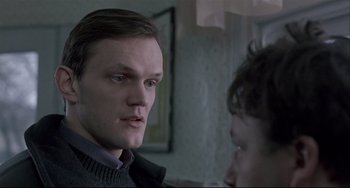 Movie still from “Three Colors: White” (1994), directed by Krzysztof Kieslowski – Close Up shot, Low angle