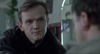 Movie still from “Three Colors: White” (1994), directed by Krzysztof Kieslowski – Close Up shot, Over the shoulder angle