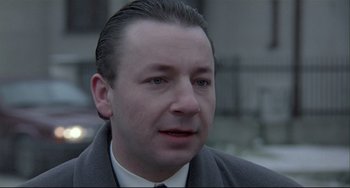 Movie still from “Three Colors: White” (1994), directed by Krzysztof Kieslowski – Close Up shot, Over the shoulder angle