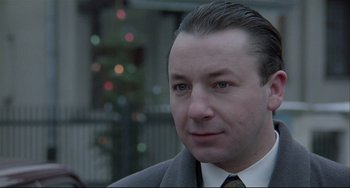 Movie still from “Three Colors: White” (1994), directed by Krzysztof Kieslowski – Close Up shot, Low angle