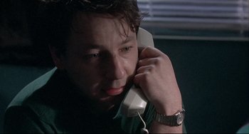 Movie still from “Three Colors: White” (1994), directed by Krzysztof Kieslowski – Close Up shot, Low angle