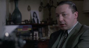 Movie still from “Three Colors: White” (1994), directed by Krzysztof Kieslowski – Close Up shot, Over the shoulder angle