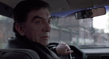 Movie still from “Three Colors: White” (1994), directed by Krzysztof Kieslowski – Close Up shot, Low angle