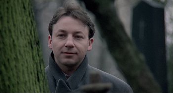 Movie still from “Three Colors: White” (1994), directed by Krzysztof Kieslowski – Close Up shot, Low angle