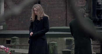 Movie still from “Three Colors: White” (1994), directed by Krzysztof Kieslowski – Medium shot, Over the shoulder angle