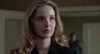 Movie still from “Three Colors: White” (1994), directed by Krzysztof Kieslowski – Close Up shot, Over the shoulder angle