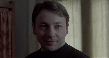 Movie still from “Three Colors: White” (1994), directed by Krzysztof Kieslowski – Close Up shot, Low angle