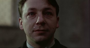 Movie still from “Three Colors: White” (1994), directed by Krzysztof Kieslowski – Close Up shot, Low angle