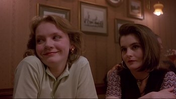 Movie still from “Trainspotting” (1996), directed by Danny Boyle – Two women sitting in front of each other in a room; Close Up shot, Low angle