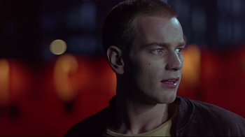 Movie still from “Trainspotting” (1996), directed by Danny Boyle – A person wearing a yellow shirt; Close Up shot, Low angle