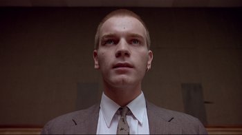 Movie still from “Trainspotting” (1996), directed by Danny Boyle – A person wearing a suit and tie; Close Up shot, Low angle