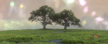 Movie still from “99 Homes” (2014), directed by Ramin Bahrani – Two large trees in a grassy field with a cloudy sky in the background; Extreme Wide shot, High angle