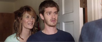 Movie still from “99 Homes” (2014), directed by Ramin Bahrani – A man and a woman standing next to each other in a room; Close Up shot, Over the shoulder angle