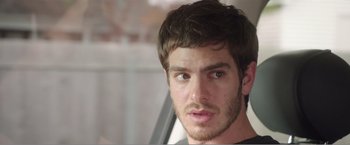 Movie still from “99 Homes” (2014), directed by Ramin Bahrani – A person with a beard; Close Up shot, Over the shoulder angle