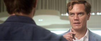 Movie still from “99 Homes” (2014), directed by Ramin Bahrani – A man is looking at himself in the mirror; Close Up shot, Over the shoulder angle