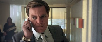 Movie still from “99 Homes” (2014), directed by Ramin Bahrani – A person talking on a cell phone; Close Up shot, Low angle