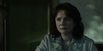Movie still from “Chernobyl” (2019), directed by Johan Renck – A person sitting in a room; Close Up shot, Over the shoulder angle