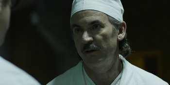 Movie still from “Chernobyl” (2019), directed by Johan Renck – A person wearing a white hat; Close Up shot, Low angle