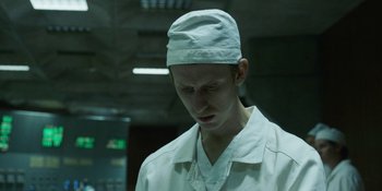 Movie still from “Chernobyl” (2019), directed by Johan Renck – A man in a white lab coat and hat; Close Up shot, Low angle