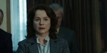 Movie still from “Chernobyl” (2019), directed by Johan Renck – A woman in a suit and a man in a suit; Close Up shot, Over the shoulder angle