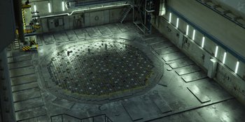 Movie still from “Chernobyl” (2019), directed by Johan Renck – An empty room with a large circular area in the middle; Extreme Wide shot, Overhead angle