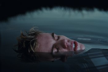 Movie still from “The Kid Laroi - Bleed” (2023), directed by Ramez Silyan – Medium shot, Overhead angle