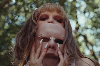 Movie still from “The Kid Laroi - Bleed” (2023), directed by Ramez Silyan – Extreme Close Up shot, High angle