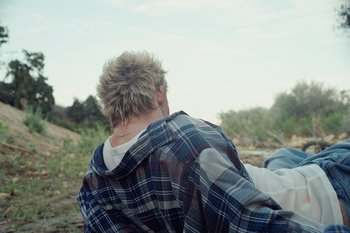 Movie still from “The Kid Laroi - Bleed” (2023), directed by Ramez Silyan – Medium shot, Over the shoulder angle