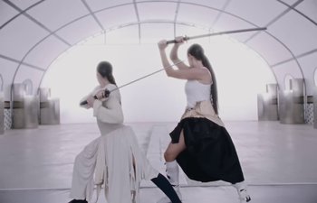 Movie still from “Björk, Rosalía - Oral” (2023), directed by Carlota Guerrero – Wide shot, Low angle